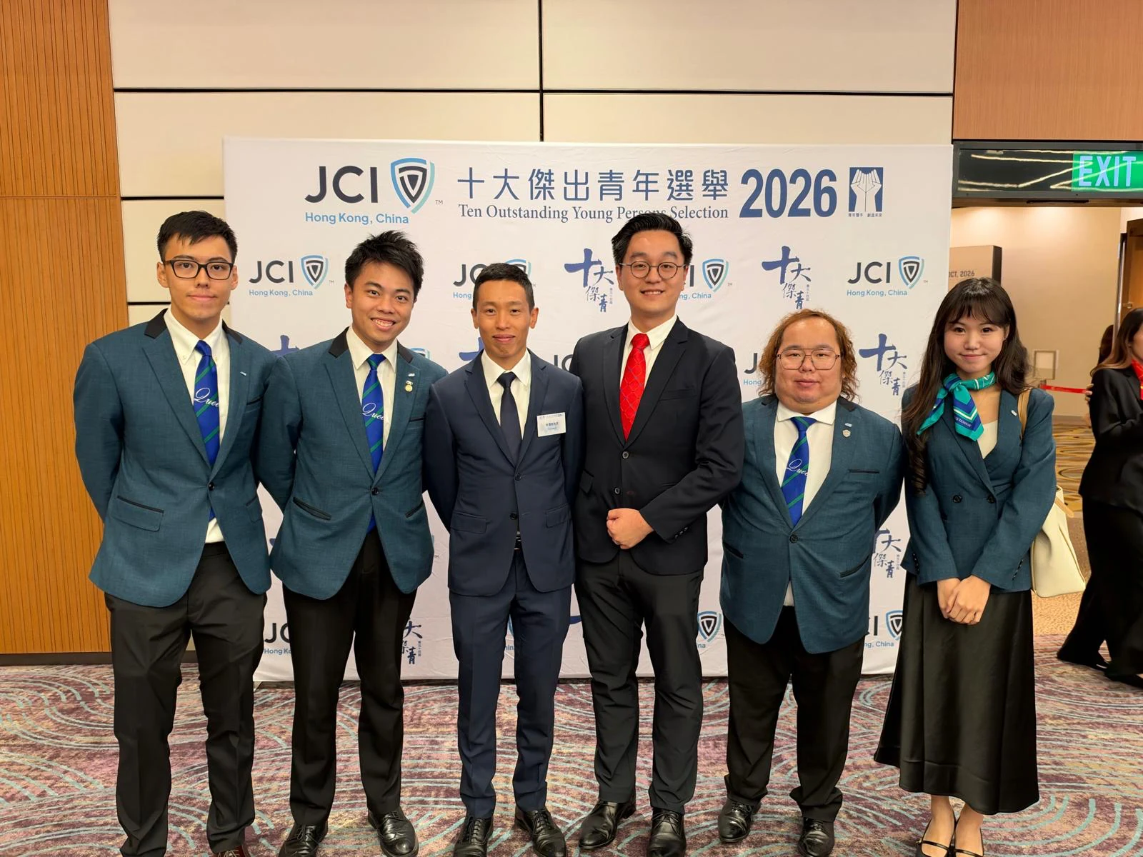 Six attendees pose in front of the Hong Kong TOYP 2026 event backdrop.